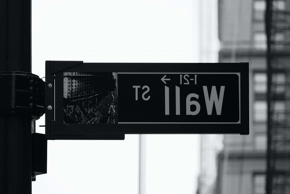 new york grayscale photo of Wall St. signage money